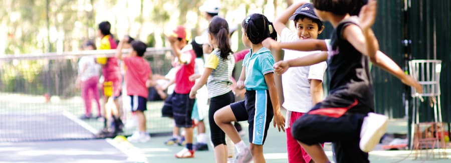 Children in the half-acre garden campus at the magic years